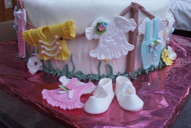 Closeup of edible gumpaste baby clothes(not the clearest pictures!  sorry)