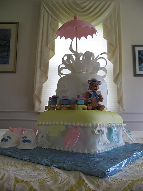 Another view of the baby shower cake with baby shoes
