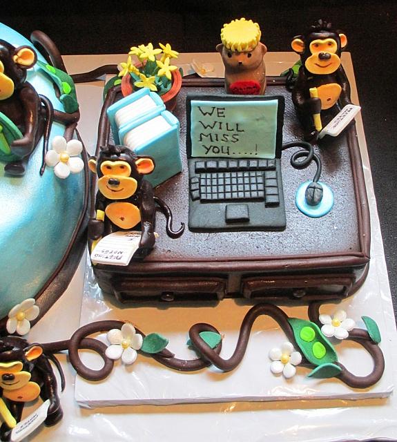 Retirement Desk With Monkeys Computer Animal Crackers Jar Books Flower Vase Top view