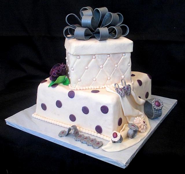 PresentFondantCakeWithBowJewelryCarnationsSide