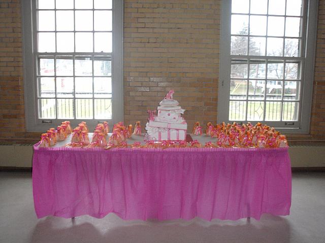 Quinceanera Cake in Pink and White with Stacked Presents, Edible Fashion Shoe, Pillow, and Princess Crown on table