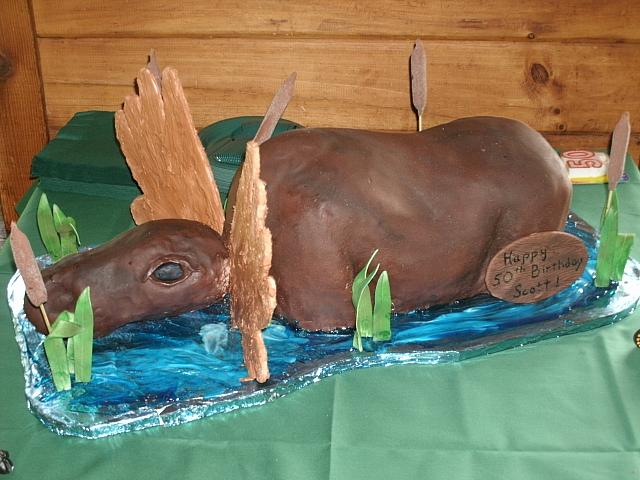 Carved Moose Cake Sitting In Pond main view