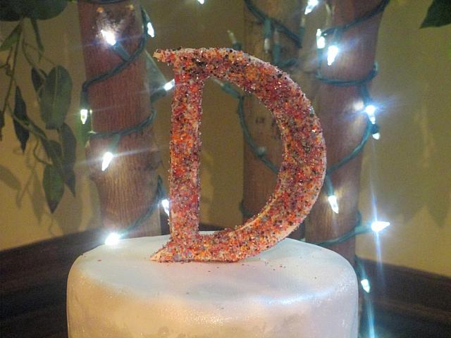 WeddingCakeMonogramWithMultiColoredSugarCrystals