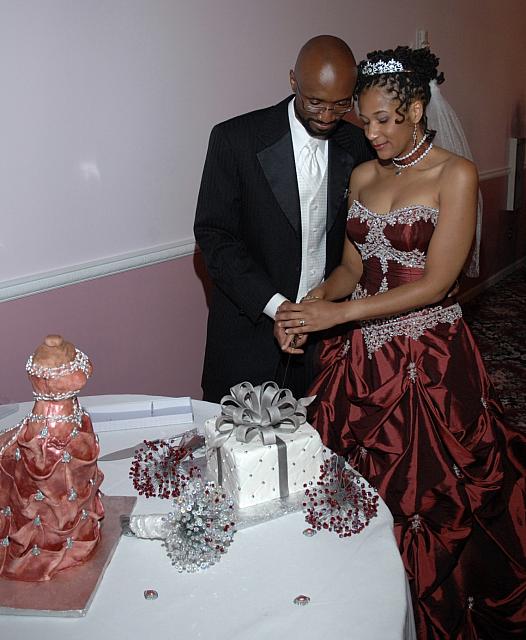 Bride and Groom cutting their present cake