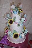 Gumpaste sunflowers, irises, and tulips.  All decorations are edible.