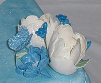 Pregnant Baby Shower close up of floral arrangment - tulips, butterfly, blue flowers