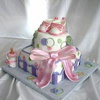 Whimsical Baby Shower Cake in Pink, Green, and Purple with Edible Gumpaste baby Shoes, Baby Bottle, and Safety Pins view 1