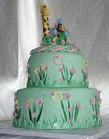 Safari or Zoo Themed Green, Pink, and Yellow Baby Shower Cake with edible Giraffe, Monkey, and Circus Elephant