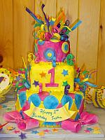 Whimsical Mardi Gras First Birthday Cake
