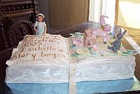 Baby book Cake or Christening Cake with gumpaste figurines and fondant