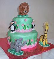 Zoo Animals Child Birthday Cake with Pink Flowers And Grass Side Design