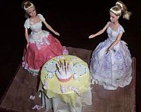 Doll cake with Two dolls and table set up for birthday party