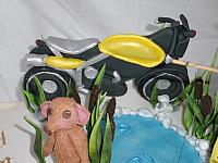 Baby Story Book motorcycle close up.  Motorcyle is handmade, edible gumpaste.