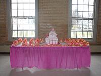 Quinceanera Cake in Pink and White with Stacked Presents, Edible Fashion Shoe, Pillow, and Princess Crown on table
