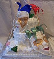 Fondant covered cake with edible, gumpaste masks and gumpaste flowers for Epilepsy fundraiser