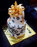 Whimsical Black and White Fondant Cake with Gold Bow and Silver Dragree Accents
