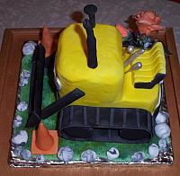 Bulldozer cake covered in fondant with gumpaste attachments