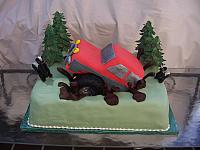 Groom's Off Road Truck Cake in chocolate mud with edible trees and hand modeled skunks