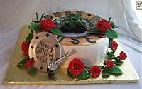 Side view of Greg's birthday cake. the metallic plate is edible. The vines and leaves are edible.