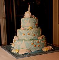 Nautical wedding cake with gumpaste shells and sailboats