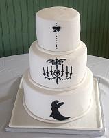 White fondant covered Wedding Cake with dancing couple silhouette cut out of gumpaste under royal icing decorated chandelier View 2