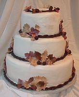 Fall Leaves Wedding Cake with Burgundy, Brown, and Beige Edible Gumpaste Leaves and Dark Chocolate Acorns