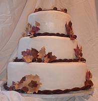 Fall Leaves Wedding Cake with Burgundy, Brown, and Beige Edible Gumpaste Leaves and Dark Chocolate Acorns view 1